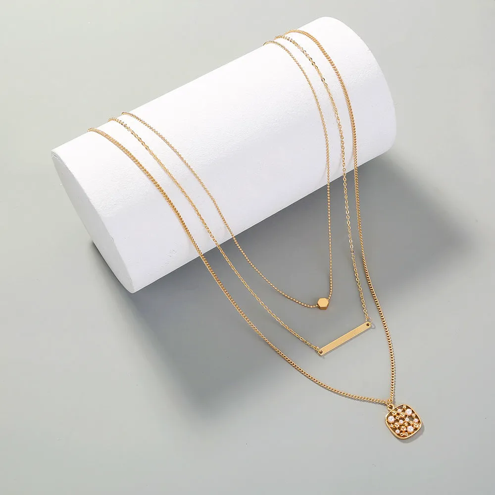 Multi-layer gold necklace with geometric pineapple pendant on adjustable chain, electroplated finish, zinc alloy
