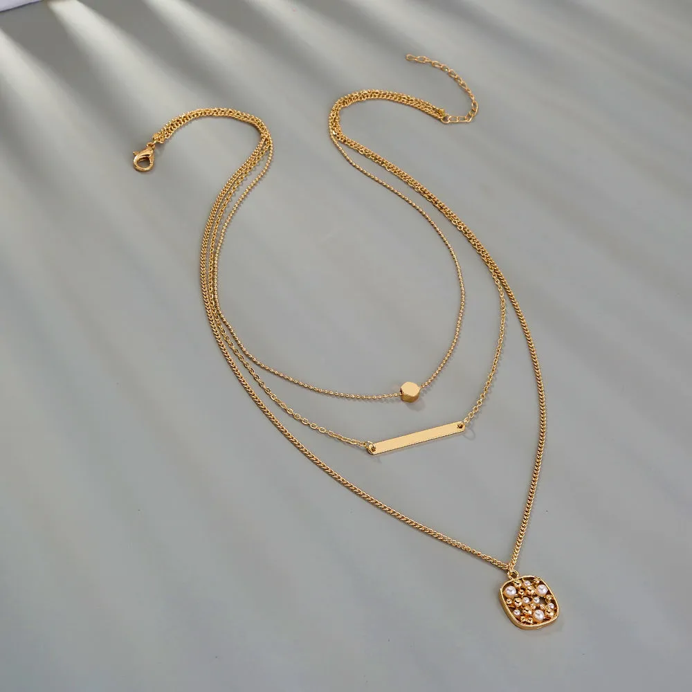 Multi-layer gold necklace with geometric pineapple pendant on adjustable chain, electroplated finish, zinc alloy