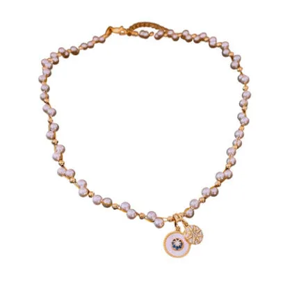 Gold electroplated necklace with round imitation pearl pendant and Chinese style geometric design