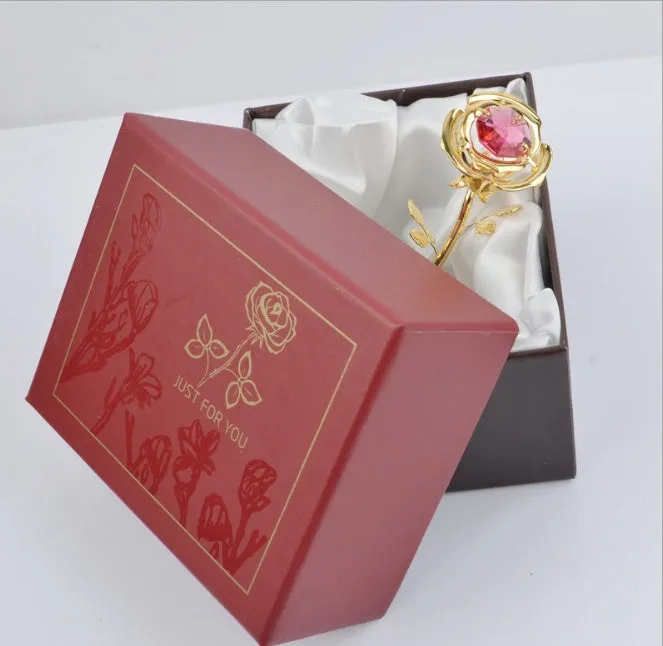 Gold artificial rose with diamond accent decoration on display