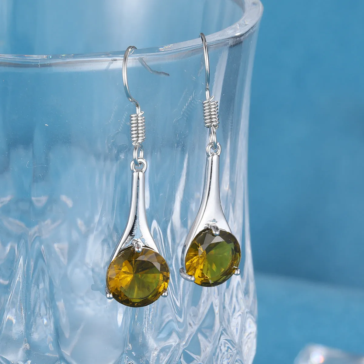 Women's olive green topaz earrings with water drop shape and retro minimalist design