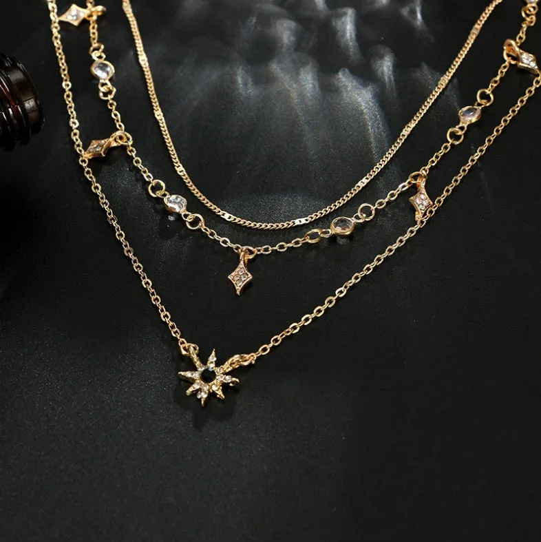 Handmade alloy multi-layer star pendant necklace in gold colour with layered chains and star pendants