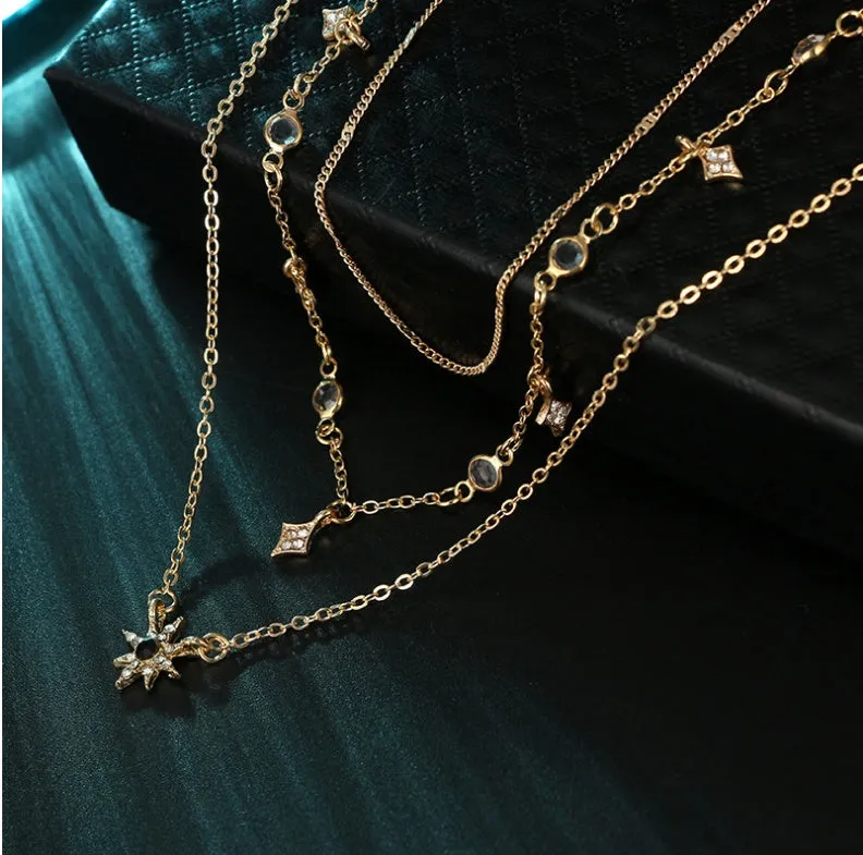 Handmade alloy multi-layer star pendant necklace in gold colour with layered chains and star pendants