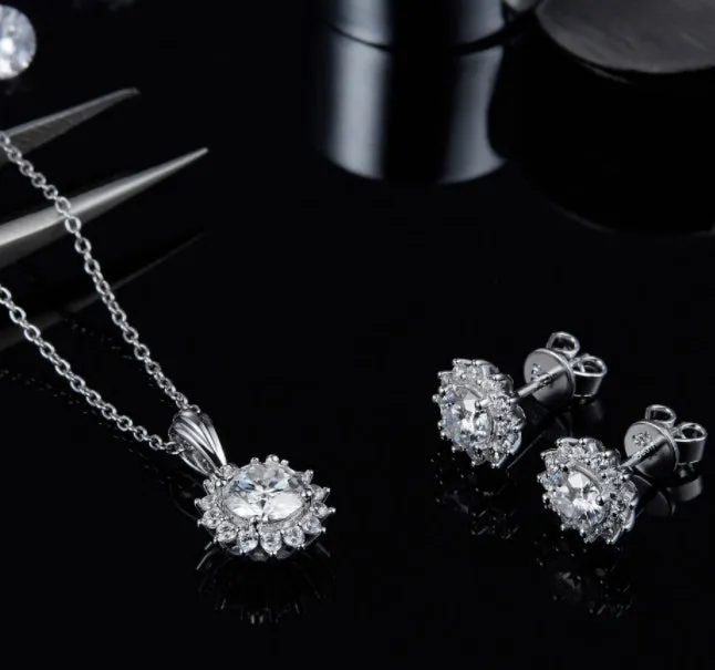 925 silver three-piece jewellery set with moissanite pendant necklace, stud earrings, and bracelet on display