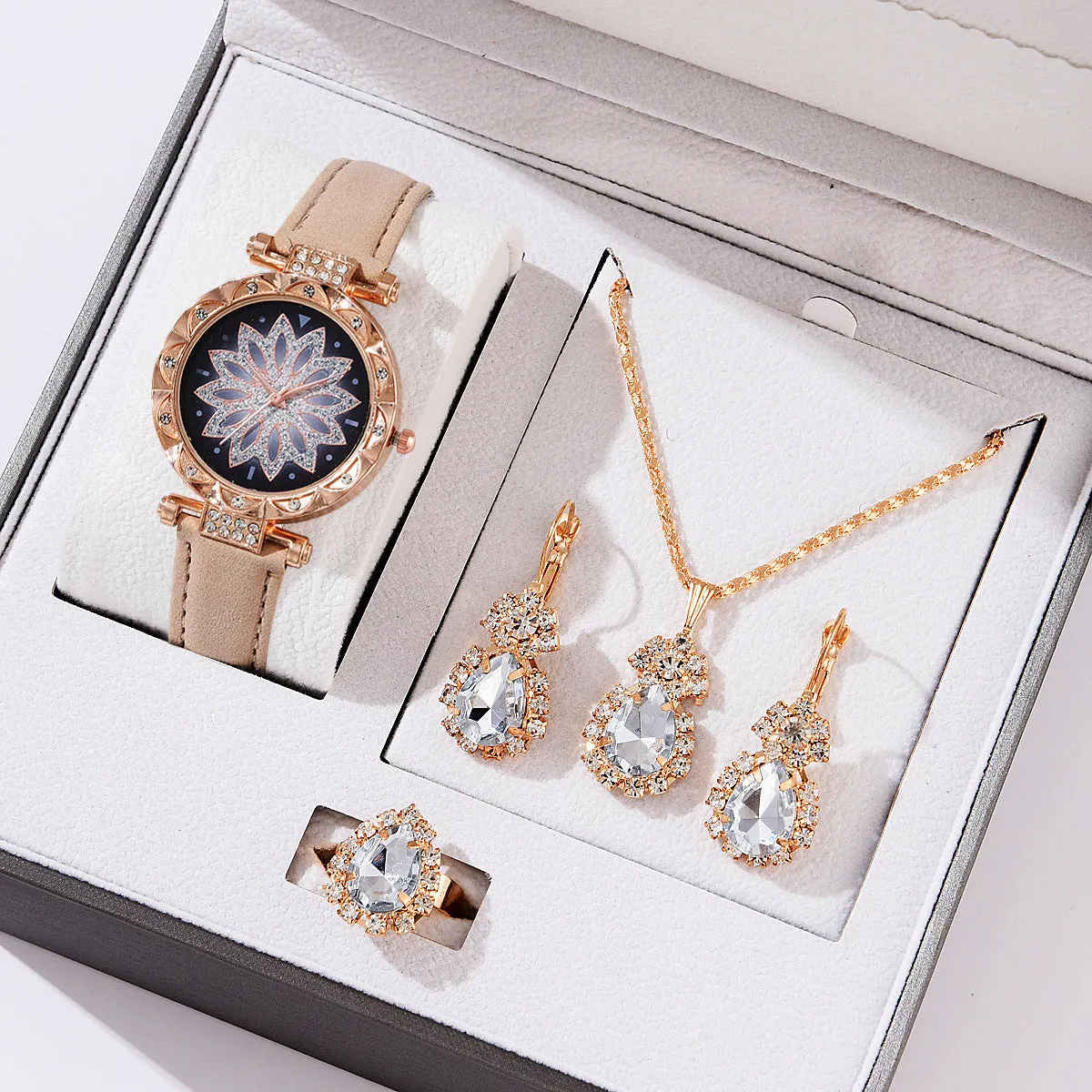 Women's quartz watch bracelet set with faux leather strap, circular dial, and matching jewellery in a colour suit