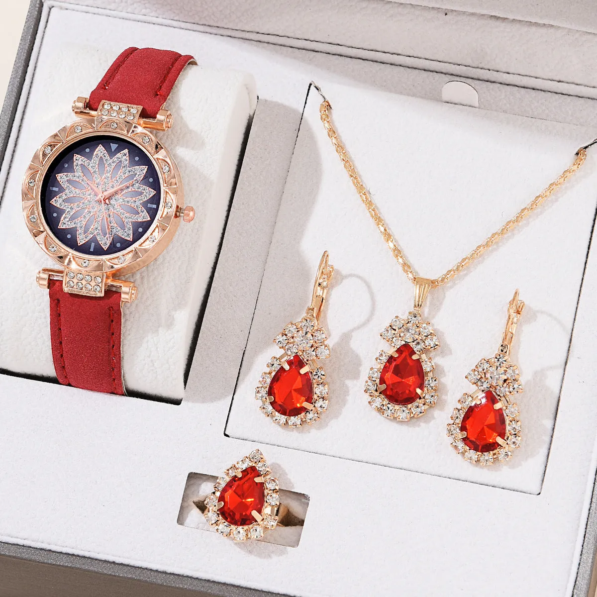 Women's quartz watch bracelet set with faux leather strap, circular dial, and matching jewellery in a colour suit