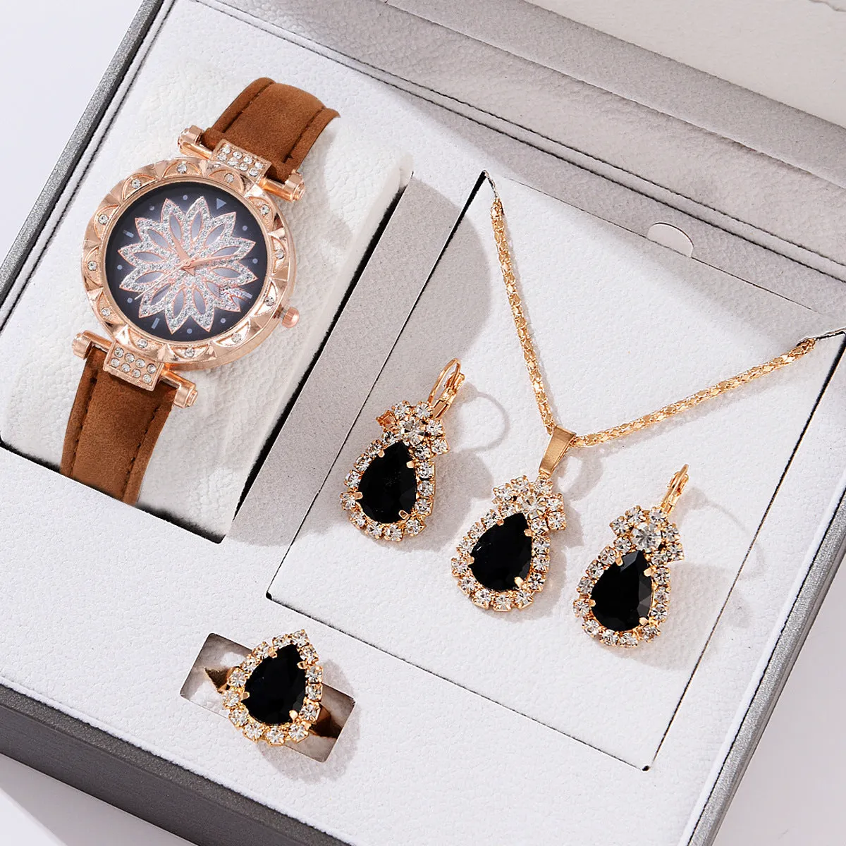 Women's quartz watch bracelet set with faux leather strap, circular dial, and matching jewellery in a colour suit