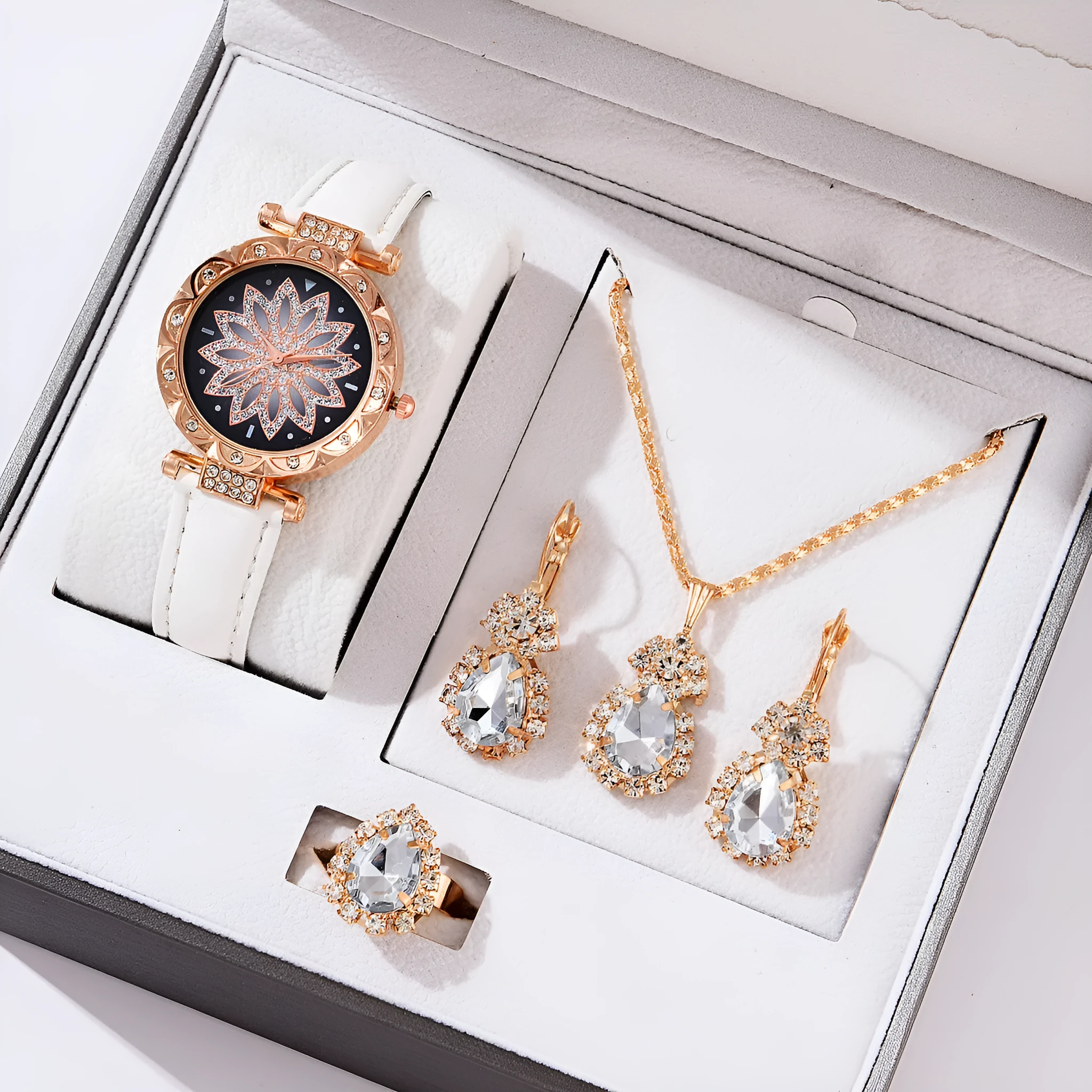Women's quartz watch bracelet set with faux leather strap, circular dial, and matching jewellery in a colour suit