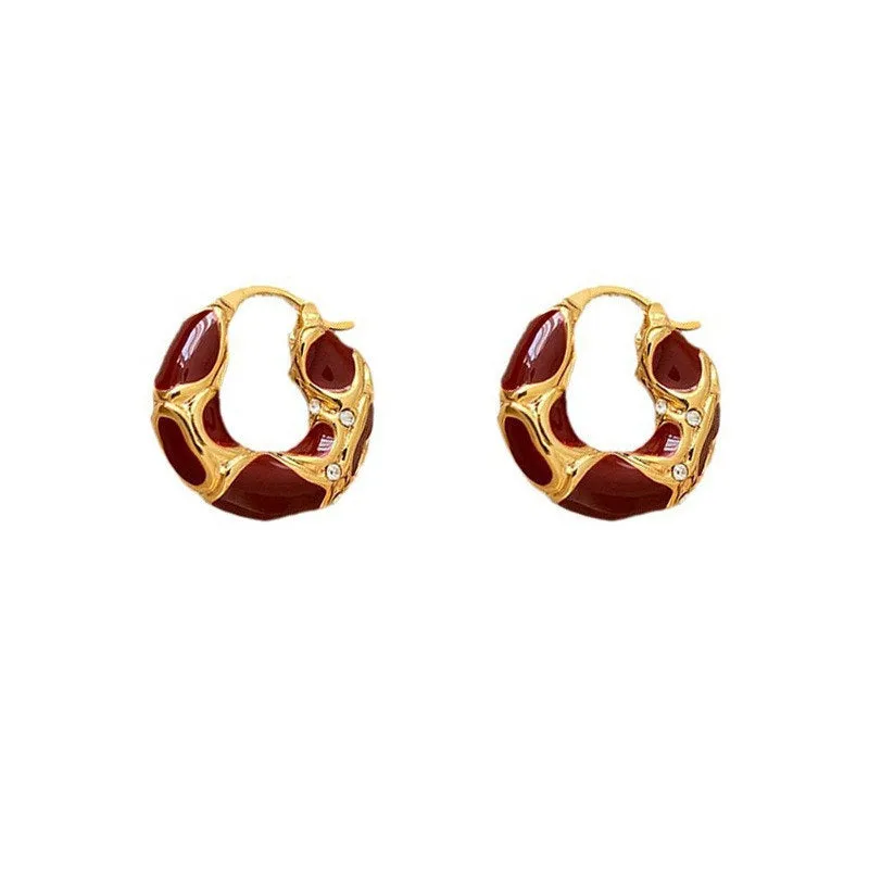 Gold plated alloy small hoop earrings with enamel colour in red, black, and white geometric shapes