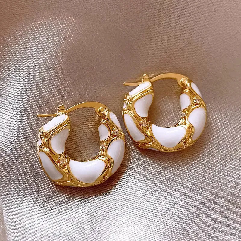 Gold plated alloy small hoop earrings with enamel colour in red, black, and white geometric shapes