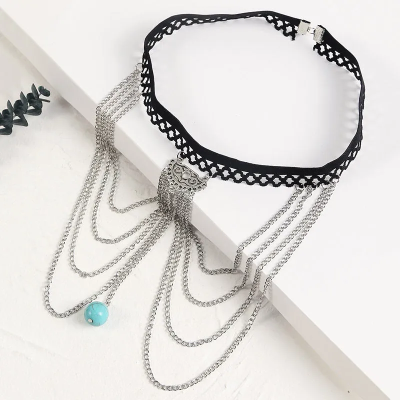 Women's white pearl multi-layer geometric body chain anklet on a light background