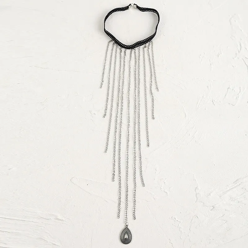 Women's white pearl multi-layer geometric body chain anklet on a light background