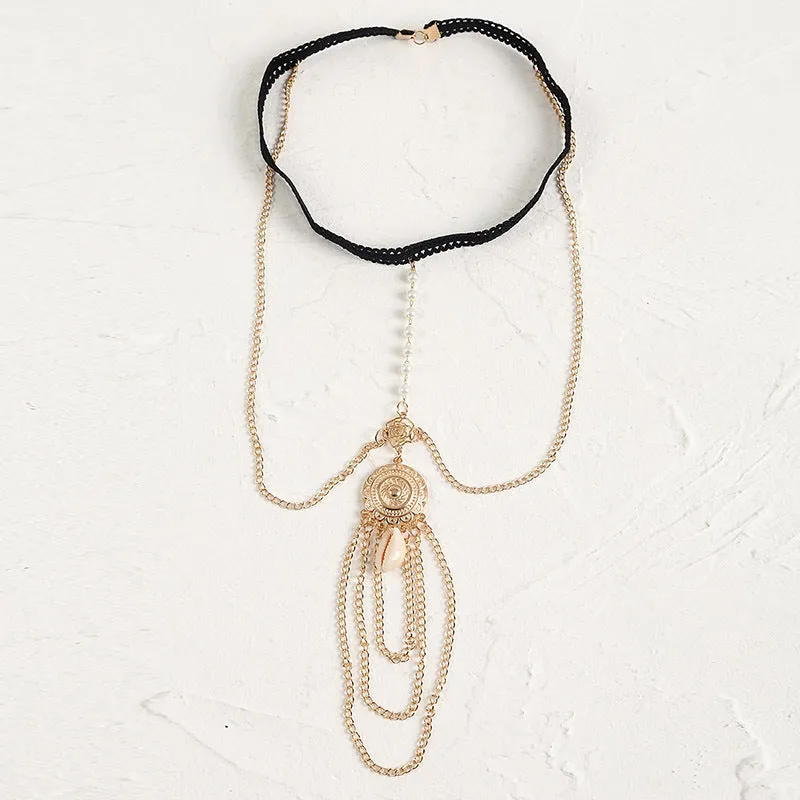 Women's white pearl multi-layer geometric body chain anklet on a light background
