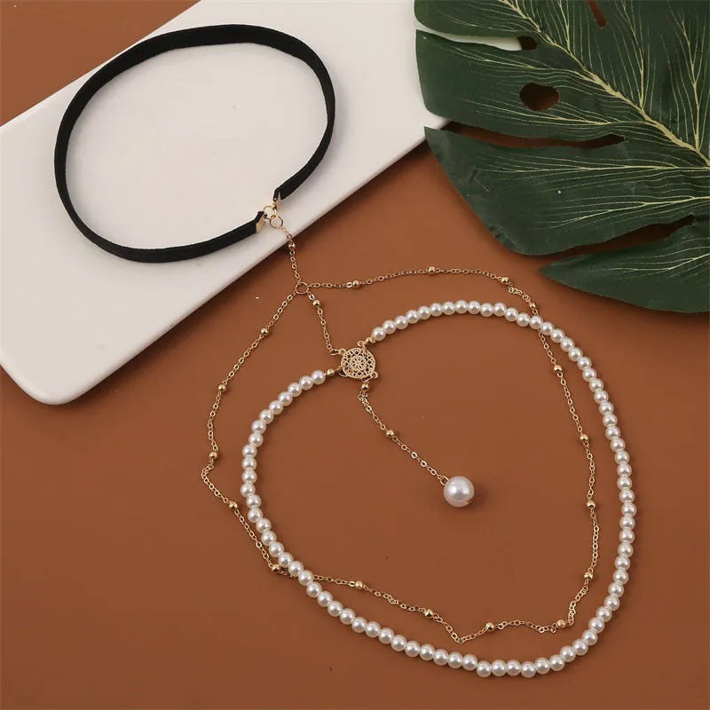 Women's white pearl multi-layer geometric body chain anklet on a light background