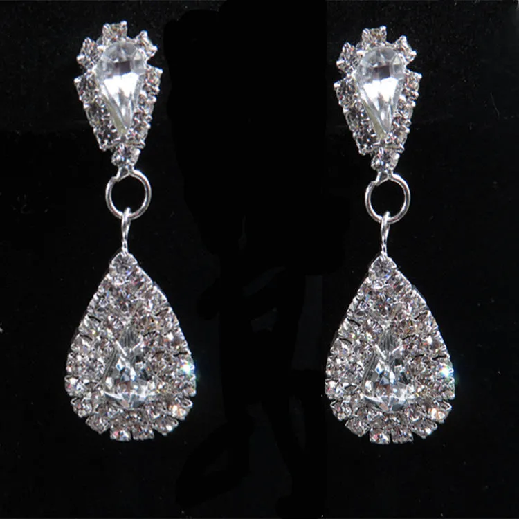 Gold bride wedding accessories set with drop earrings and necklace on white background