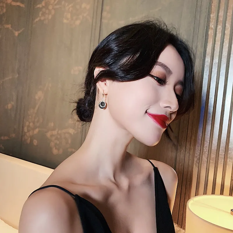 Black geometric alloy earrings with round pieces and 3.6cm length, retro Hong Kong style design.