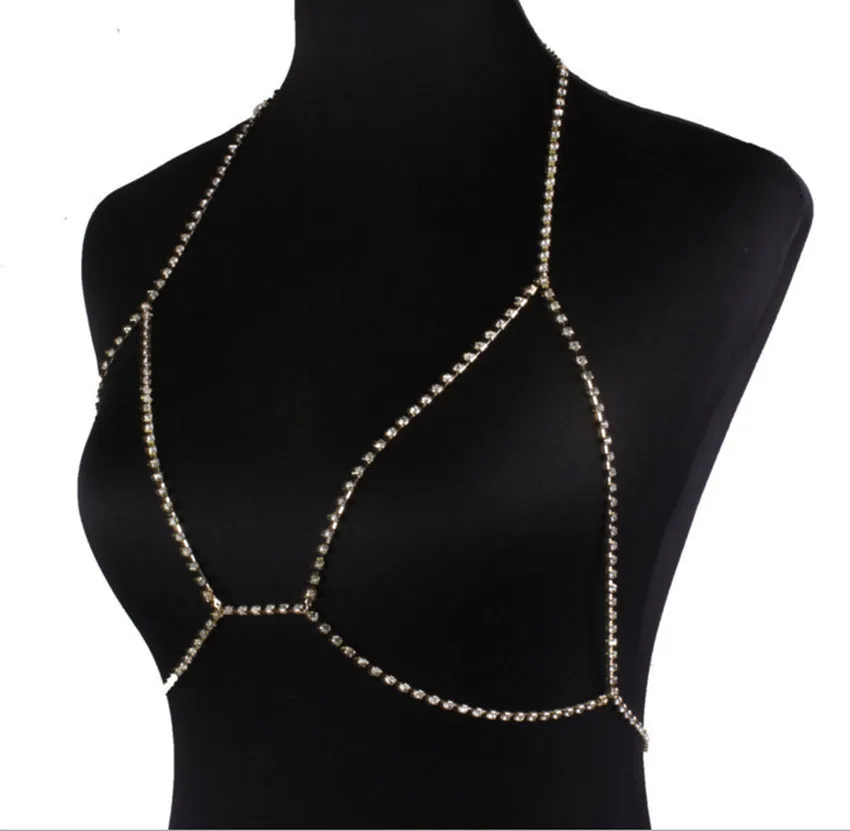 Women's rhinestone metal body chain necklace in gold on a model showing torso wear
