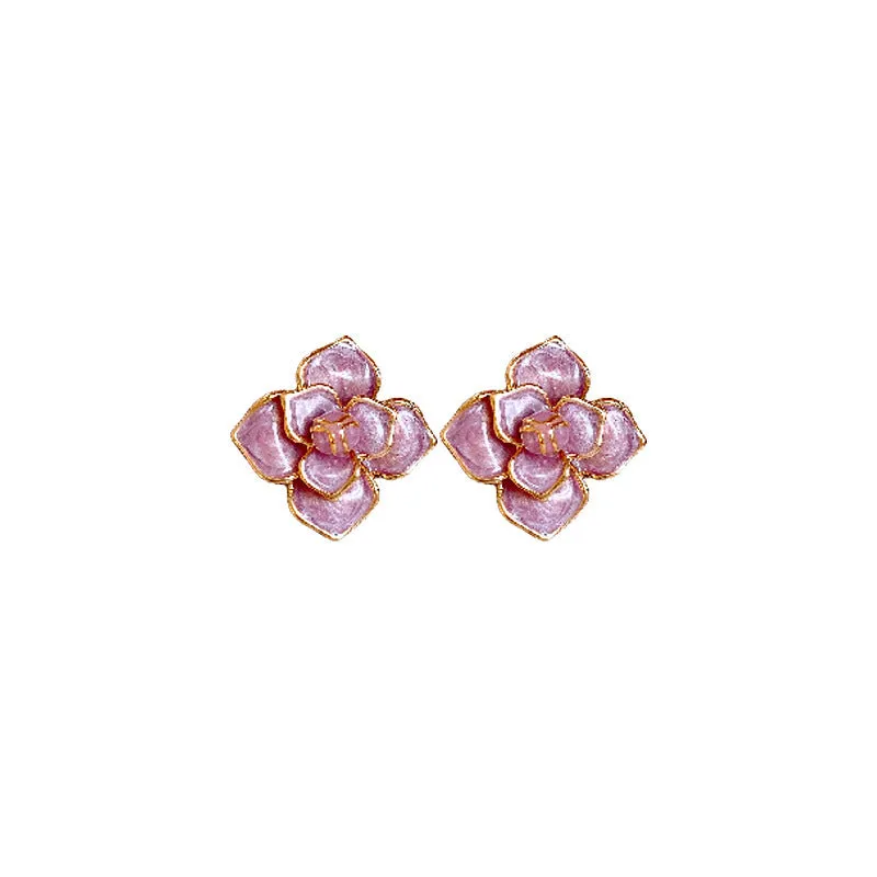 A pair of gold-plated purple oil-spot glaze flower stud earrings made from copper, showing detailed floral texture.