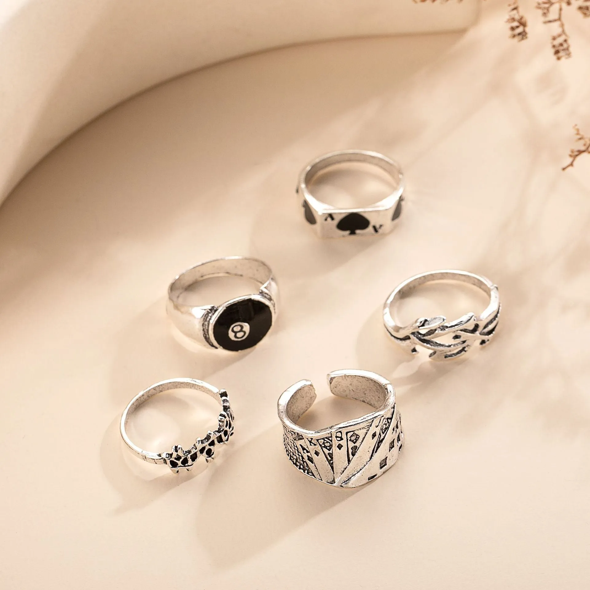 Black alloy poker ring with retro spade card design showing adjustable sizing feature