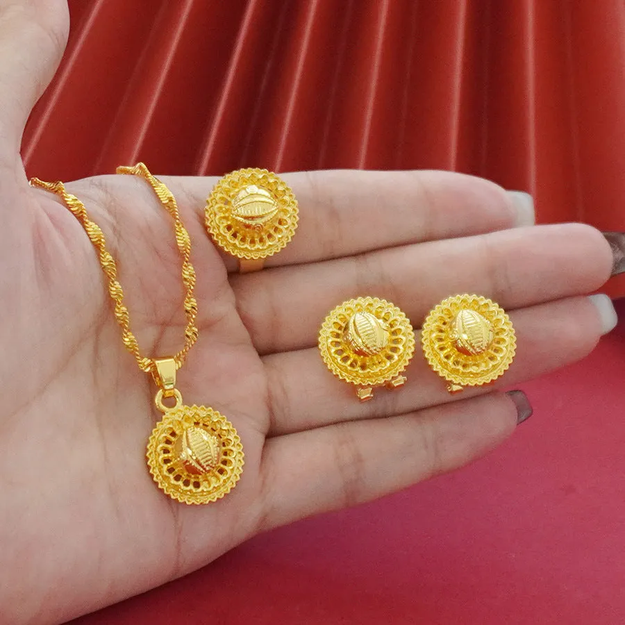 Gold-plated three-piece jewellery set with floral designs showing necklace, earrings, and ring