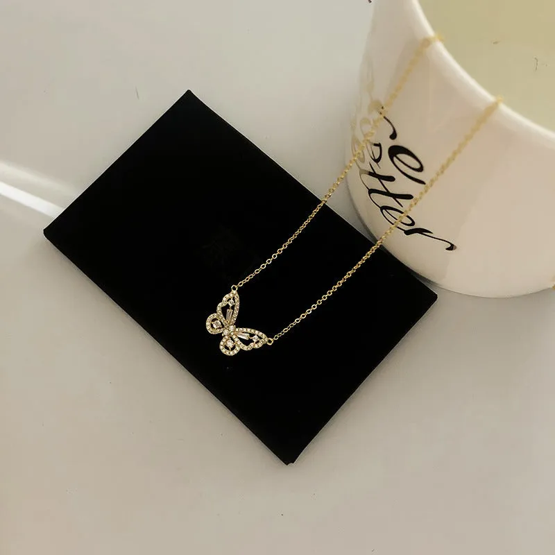 Butterfly pendant necklace with micro-inlaid zircon on water wave chain, gold finish, clavicle length