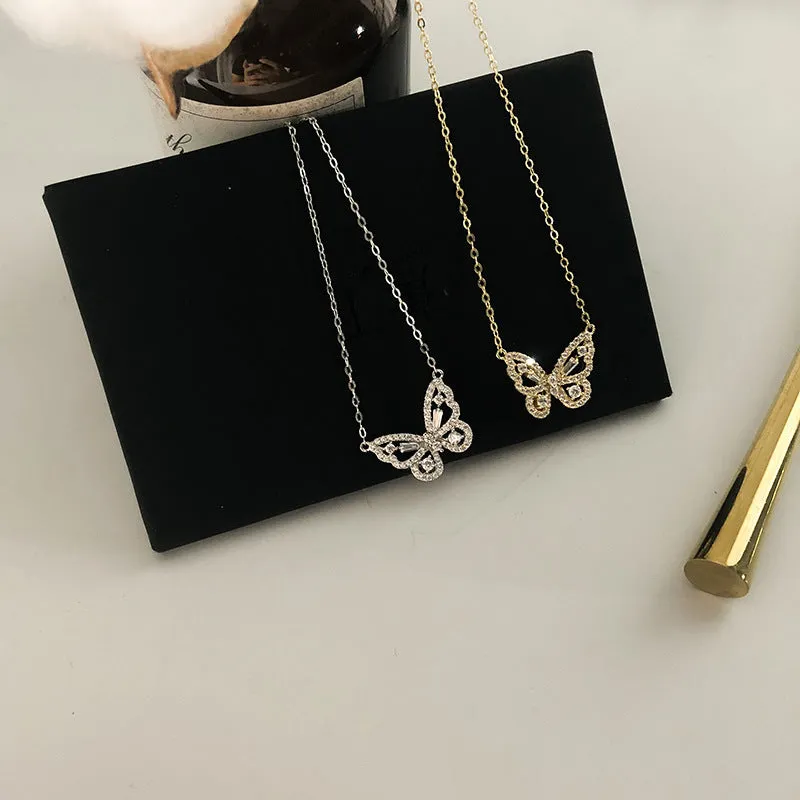 Butterfly pendant necklace with micro-inlaid zircon on water wave chain, gold finish, clavicle length