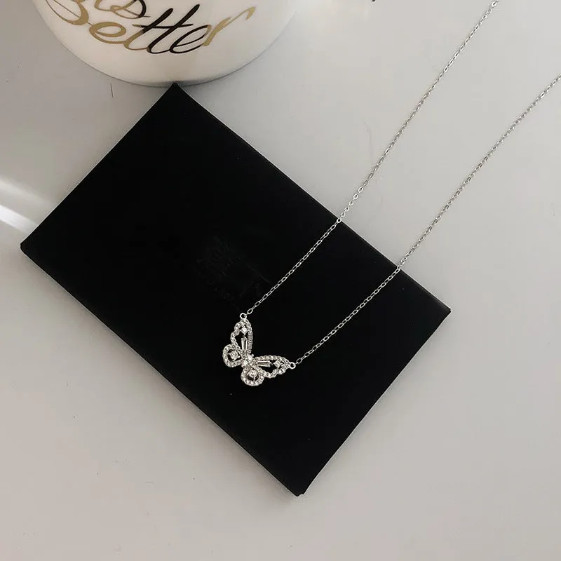 Butterfly pendant necklace with micro-inlaid zircon on water wave chain, gold finish, clavicle length