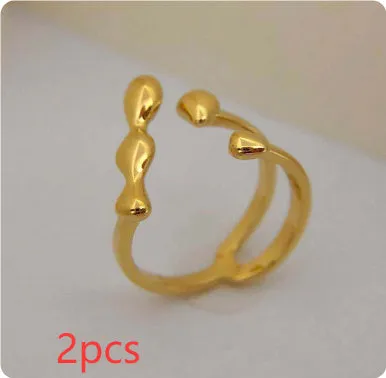 Adjustable brass ring with sphere design in gold or silver plating.