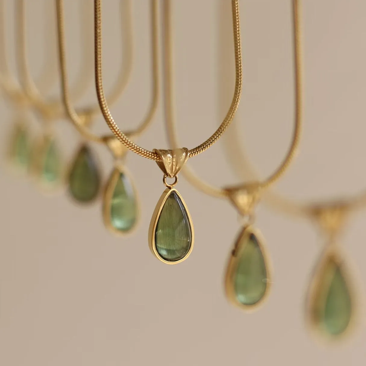 Retro water drop necklace for women with blue gemstone pendant on titanium steel snake bone chain.