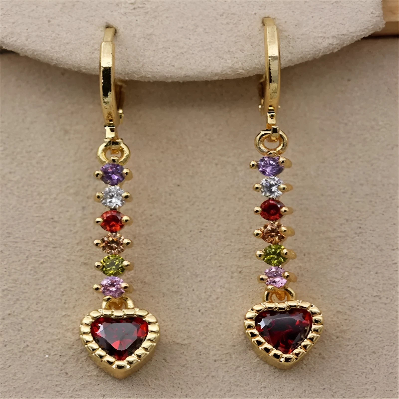 Pair of women's heart-shaped alloy earrings with electroplated gold or silver finish.