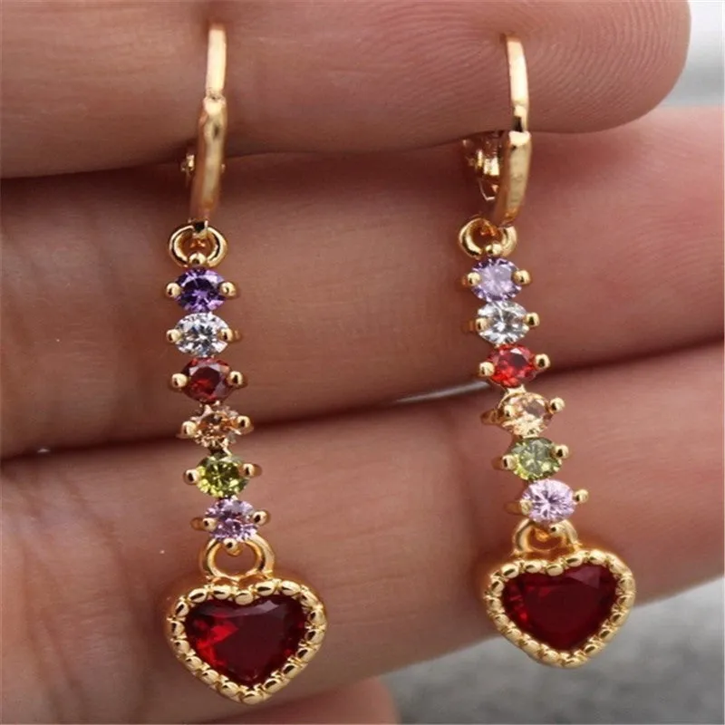 Pair of women's heart-shaped alloy earrings with electroplated gold or silver finish.
