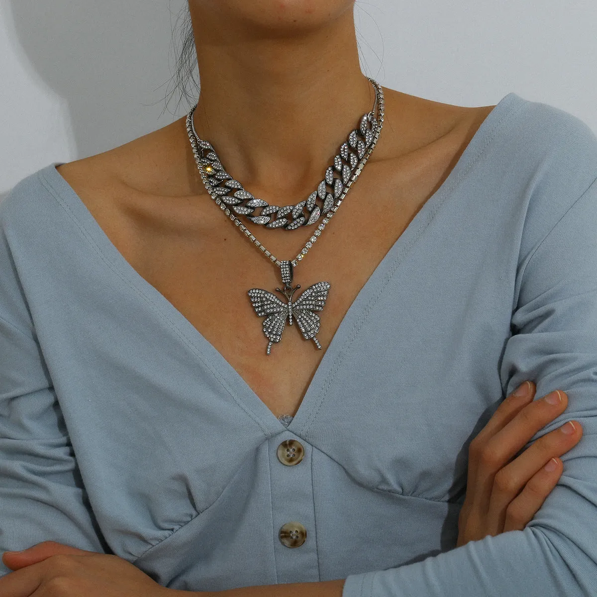 Butterfly-shaped alloy pendant necklace with rhinestone accents, gold electroplated finish