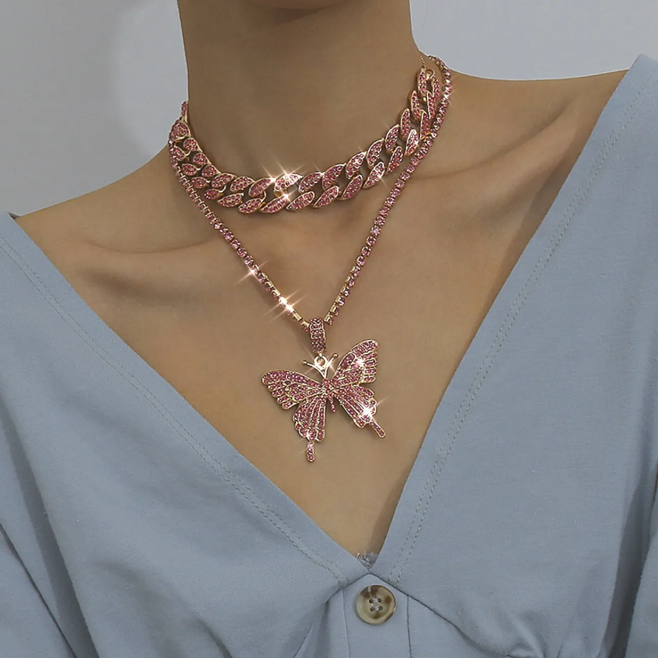 Butterfly-shaped alloy pendant necklace with rhinestone accents, gold electroplated finish