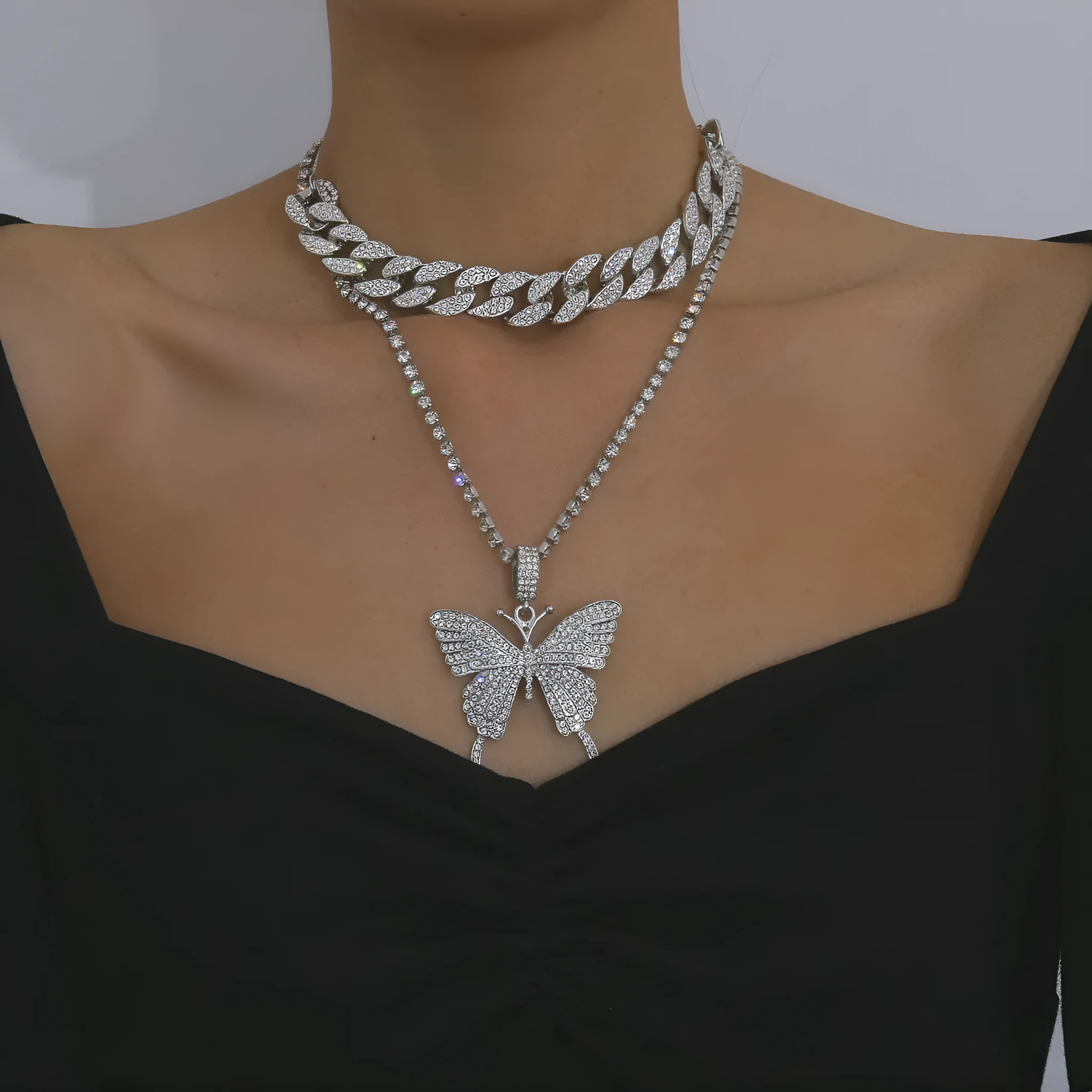 Butterfly-shaped alloy pendant necklace with rhinestone accents, gold electroplated finish