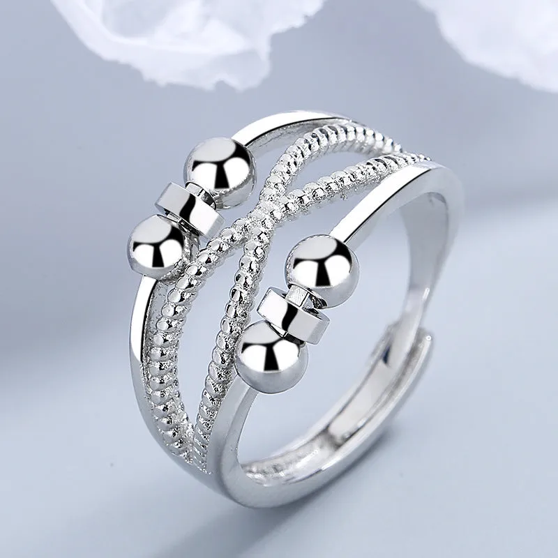 Rotatable copper ring with open design double-layered hollow line construction in platinum colour geometric shape