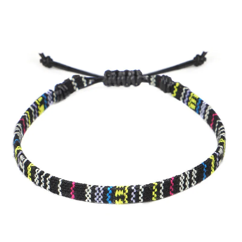 Hand woven rainbow colour bohemian style cloth anklet on a neutral background