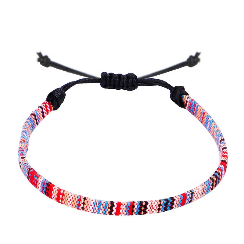 Hand woven rainbow colour bohemian style cloth anklet on a neutral background