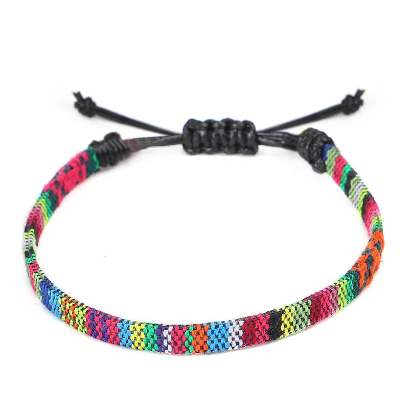 Hand woven rainbow colour bohemian style cloth anklet on a neutral background