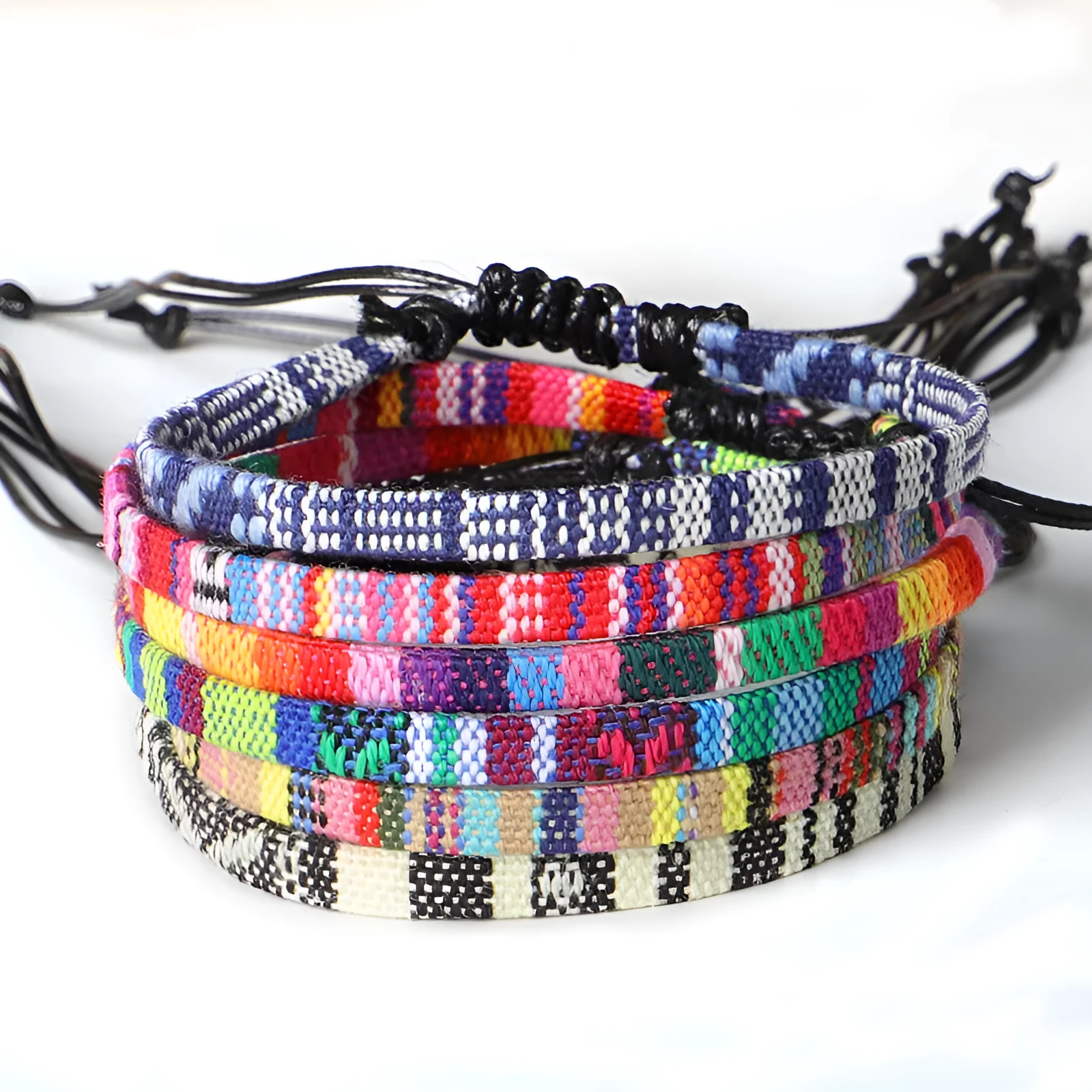 Hand woven rainbow colour bohemian style cloth anklet on a neutral background