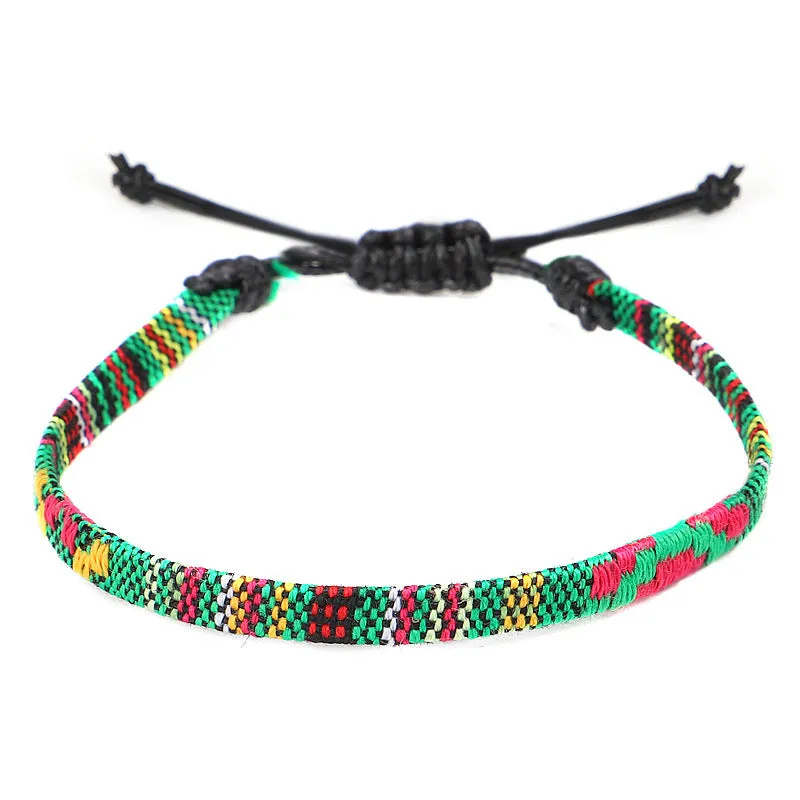 Hand woven rainbow colour bohemian style cloth anklet on a neutral background