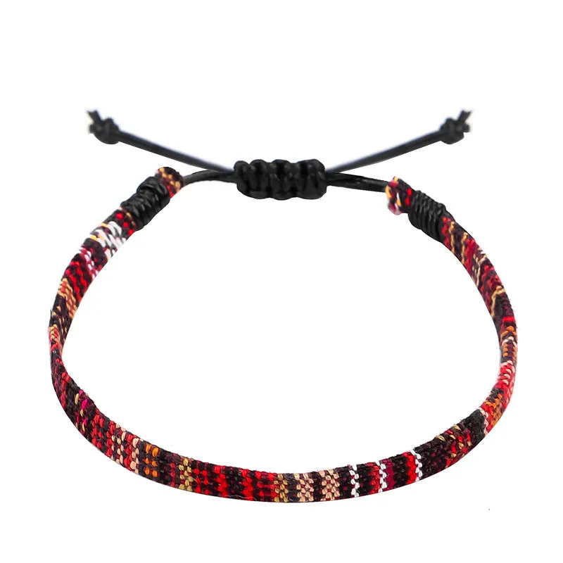 Hand woven rainbow colour bohemian style cloth anklet on a neutral background