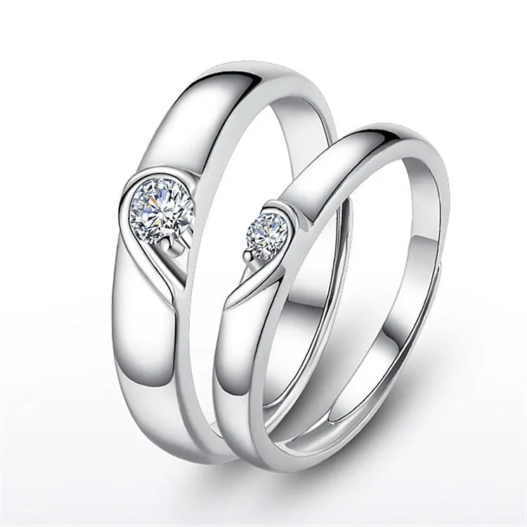 Heart-shaped diamond ring on finger, copper electroplate finish, couples wedding engagement style