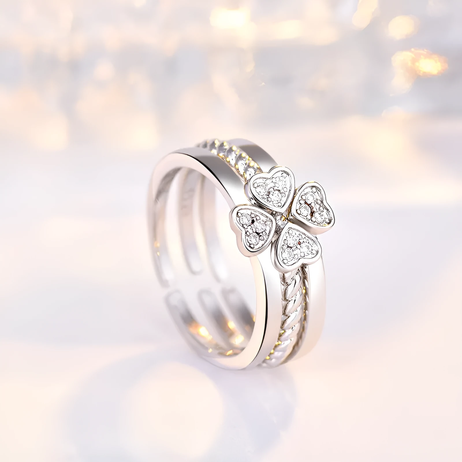 Four-leaf clover adjustable ring set for women with spinning top and zircon stones in white gold finish