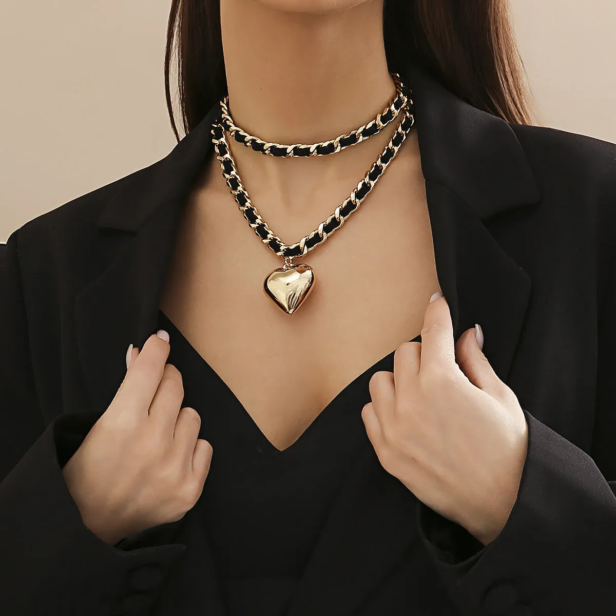 Big Love double-layer chain necklace with heart pendant in gold finish on woman
