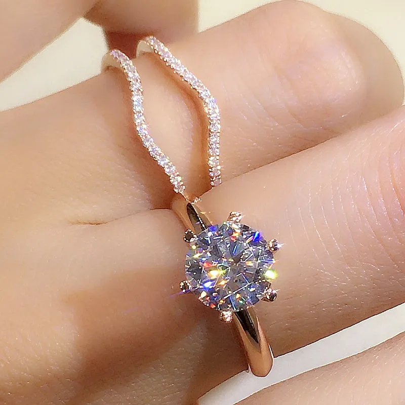 18K gold Mosonite matching ring with D colour stone in rose gold finish on white background