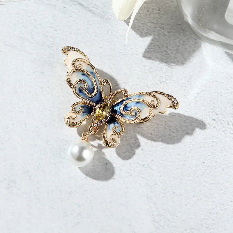 European and American style butterfly brooch in zinc alloy with artificial gems in blue, green, and red colours