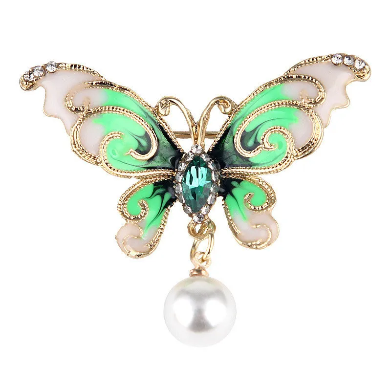 European and American style butterfly brooch in zinc alloy with artificial gems in blue, green, and red colours