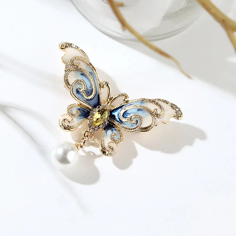 European and American style butterfly brooch in zinc alloy with artificial gems in blue, green, and red colours