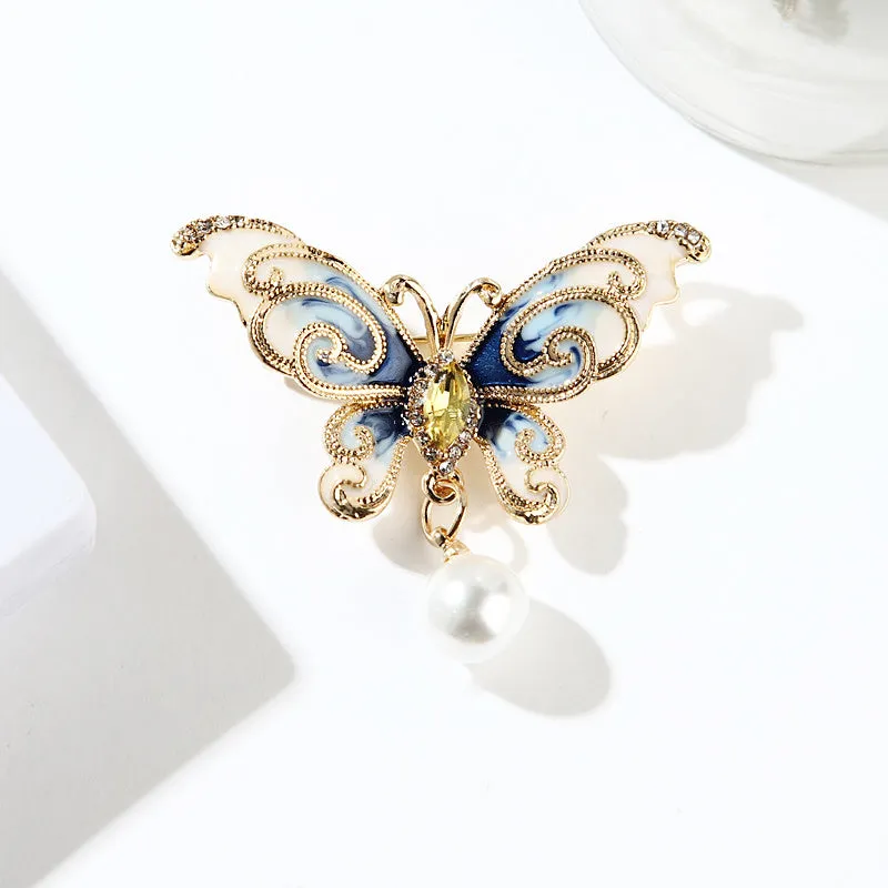 European and American style butterfly brooch in zinc alloy with artificial gems in blue, green, and red colours