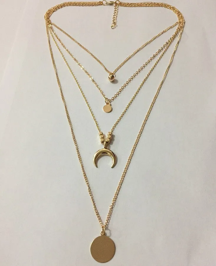 Geometric multi-layer moon disc pendant in gold alloy finish on a white background